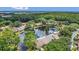 Community aerial view featuring a pond and surrounded by lush mature trees at 3902 Shoreside Cir, Tampa, FL 33624