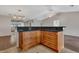 Kitchen island with granite countertop and custom cabinetry, perfect for entertaining guests at 3902 Shoreside Cir, Tampa, FL 33624