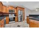 Modern kitchen with stainless steel appliances, granite countertops, and custom cabinets at 3902 Shoreside Cir, Tampa, FL 33624