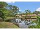 Scenic view of houses along a tranquil lake surrounded by trees at 3902 Shoreside Cir, Tampa, FL 33624