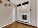 Laundry room with a washer, dryer, wood floors, and white bi-fold door at 3902 Shoreside Cir, Tampa, FL 33624