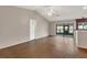 Bright, open living room with wood floors, sliding glass doors, and high ceilings at 3902 Shoreside Cir, Tampa, FL 33624