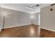 Open living room with hardwood floors and ample space for entertaining at 3902 Shoreside Cir, Tampa, FL 33624