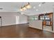 Spacious living room with vaulted ceilings, wood floors, and open access to the kitchen at 3902 Shoreside Cir, Tampa, FL 33624