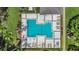 Aerial view of community pool with lounge chairs and well-kept surroundings at 3902 Shoreside Cir, Tampa, FL 33624