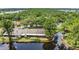 Rear view of homes backing onto a tranquil lake surrounded by trees at 3902 Shoreside Cir, Tampa, FL 33624
