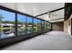 Sunroom with large windows overlooking pond at 3902 Shoreside Cir, Tampa, FL 33624