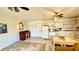 This kitchen features white appliances, a dining area, and a tiled floor at 416 73Rd N Ave # 206, St Petersburg, FL 33702