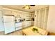 A kitchen with appliances and white cabinetry at 416 73Rd N Ave # 206, St Petersburg, FL 33702