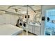 A communal laundry room is equipped with washers, dryers, sink, and folding table at 416 73Rd N Ave # 206, St Petersburg, FL 33702