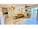 An inviting living space with a cozy yellow sofa and ceiling fans for comfortable living at 416 73Rd N Ave # 206, St Petersburg, FL 33702