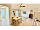 A living room features a dinette set, neutral walls, and tile flooring for a clean and modern aesthetic at 416 73Rd N Ave # 206, St Petersburg, FL 33702