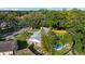 Aerial view of property with a backyard pool and lounge area, offering a glimpse of outdoor entertainment at 4307 Foxglen Ln, Tampa, FL 33624
