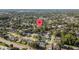 Aerial view showing a property amid a neighborhood, lush green landscape and identifying its place within the community at 4307 Foxglen Ln, Tampa, FL 33624