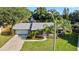 Charming single-story home with manicured lawn, lush landscaping, and a two-car garage at 4307 Foxglen Ln, Tampa, FL 33624