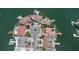 Aerial view of waterfront homes on a scenic peninsula, showcasing prime real estate at 451 Palm Ne Is, Clearwater Beach, FL 33767