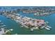 Stunning aerial view of waterfront properties, showcasing desirable coastal living and scenic waterways at 451 Palm Ne Is, Clearwater Beach, FL 33767