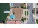 Aerial view of a luxury home with a private pool, dock, and meticulously landscaped grounds at 451 Palm Ne Is, Clearwater Beach, FL 33767