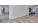 Bedroom featuring wood flooring and a decorative plant near a sliding glass door at 451 Palm Ne Is, Clearwater Beach, FL 33767