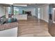 Modern kitchen with stainless steel appliances and a center island that flows into an open concept living space at 451 Palm Ne Is, Clearwater Beach, FL 33767