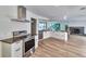 Well-appointed kitchen with stainless steel appliances, ample counter space, and a view of the fireplace at 451 Palm Ne Is, Clearwater Beach, FL 33767
