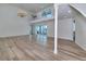 Large living room with hardwood floors, soaring ceilings, balcony access, and lots of natural light at 451 Palm Ne Is, Clearwater Beach, FL 33767