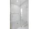 Modern bathroom featuring a glass-enclosed shower with stylish tile and gold fixtures at 468 44Th N Ave, St Petersburg, FL 33703