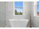 Relaxing bathroom featuring a freestanding soaking tub and elegant fixtures, offering a spa-like experience at 468 44Th N Ave, St Petersburg, FL 33703