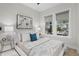 Comfortable bedroom with large windows, soft bedding, and stylish side tables at 468 44Th N Ave, St Petersburg, FL 33703