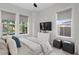 Bright bedroom with modern decor, large windows, and comfortable queen bed at 468 44Th N Ave, St Petersburg, FL 33703