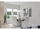 Elegant dining room featuring modern chandelier lighting, a large window, and contemporary artwork at 468 44Th N Ave, St Petersburg, FL 33703