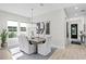 Light-filled dining room with modern chandelier, decorative artwork, and inviting ambiance at 468 44Th N Ave, St Petersburg, FL 33703