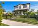 Charming two-story home with manicured lawn, fenced yard, and welcoming front porch at 468 44Th N Ave, St Petersburg, FL 33703
