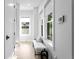 Bright hallway with bench seating and natural light streaming through windows at 468 44Th N Ave, St Petersburg, FL 33703