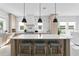 Beautiful kitchen features a large island with seating, modern appliances, and stylish light fixtures at 468 44Th N Ave, St Petersburg, FL 33703