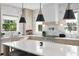 Bright, modern kitchen featuring a spacious island, stainless steel appliances, and stylish pendant lighting at 468 44Th N Ave, St Petersburg, FL 33703