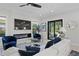 Spacious living room with a modern fireplace and cozy blue accent chairs at 468 44Th N Ave, St Petersburg, FL 33703