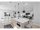 Open-concept living room with modern finishes, adjacent to the dining area and kitchen, and complete with a fireplace at 468 44Th N Ave, St Petersburg, FL 33703