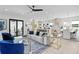 Spacious living room with modern furnishings, a ceiling fan, and abundant natural light at 468 44Th N Ave, St Petersburg, FL 33703
