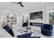 Cozy living room with modern fireplace, large TV, and comfortable seating at 468 44Th N Ave, St Petersburg, FL 33703