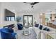 Cozy living room with modern fireplace, comfortable seating, and sliding glass doors to outdoor patio at 468 44Th N Ave, St Petersburg, FL 33703
