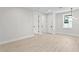 Spacious room with light floors, white walls, and three white doors showcases the home's bright interior at 468 44Th N Ave, St Petersburg, FL 33703