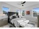 Inviting primary bedroom with a tufted headboard, plush bedding, and ample natural light at 468 44Th N Ave, St Petersburg, FL 33703