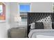 Close-up of a main bedroom with a tufted headboard and elegant nightstand at 468 44Th N Ave, St Petersburg, FL 33703