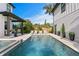 Gorgeous in-ground pool surrounded by pavers and lounge chairs, perfect for relaxing outdoors at 468 44Th N Ave, St Petersburg, FL 33703