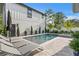 Backyard pool with in-ground spa, lounge chairs, and a well-manicured garden, creating a serene oasis at 468 44Th N Ave, St Petersburg, FL 33703
