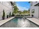 Backyard pool features a modern design with a spa, surrounded by lush landscaping and privacy fence at 468 44Th N Ave, St Petersburg, FL 33703