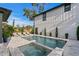 Backyard pool and spa with modern patio furniture, including lounge chairs, in a landscaped setting at 468 44Th N Ave, St Petersburg, FL 33703