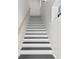 A freshly painted staircase with white risers and black treads adds a modern touch to this home's interior at 468 44Th N Ave, St Petersburg, FL 33703