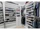Organized walk-in closet featuring custom shelving for shoes and clothing at 468 44Th N Ave, St Petersburg, FL 33703